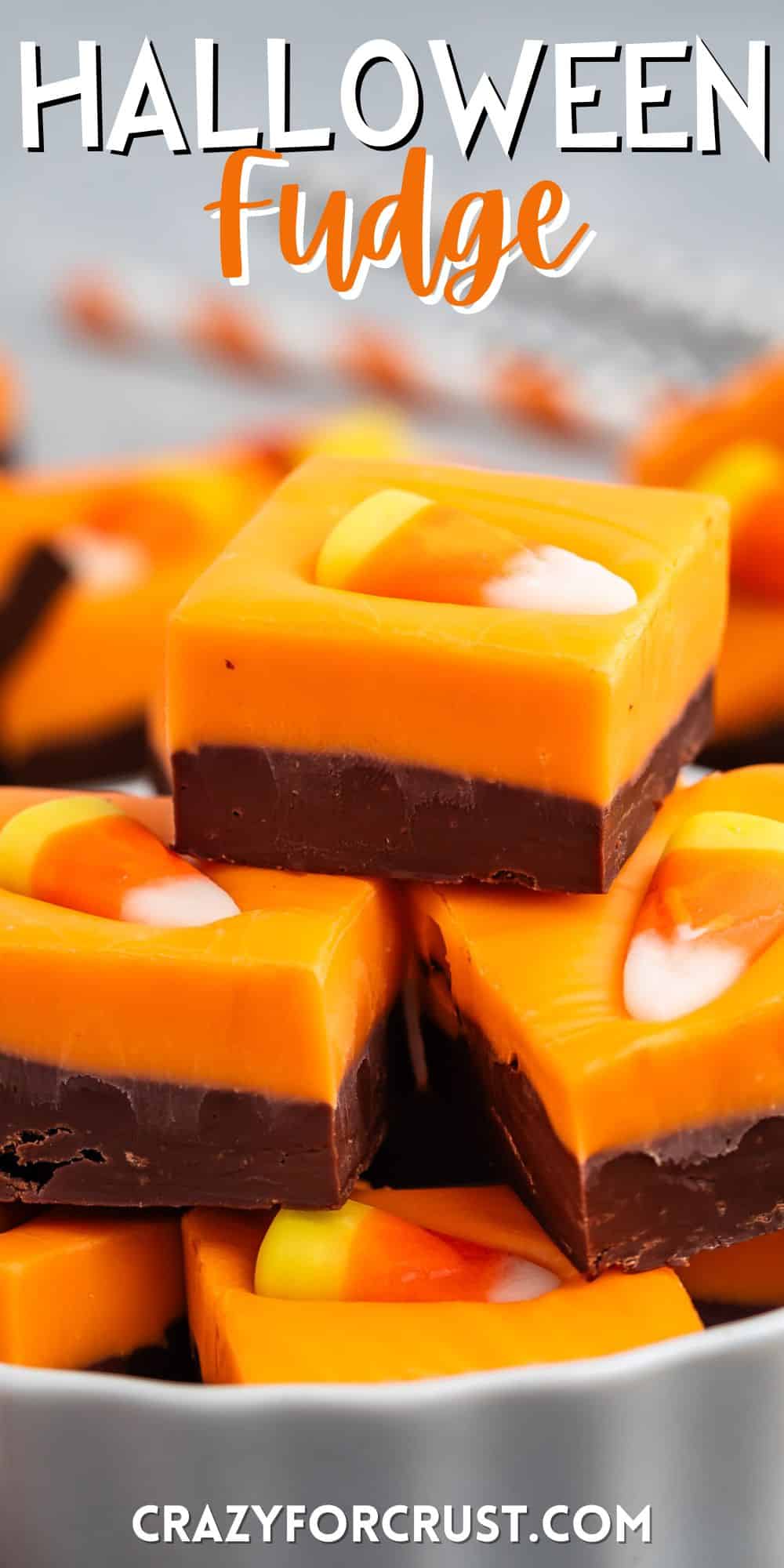 stacked brown and orange fudge with a candy corn on top with words on the image.