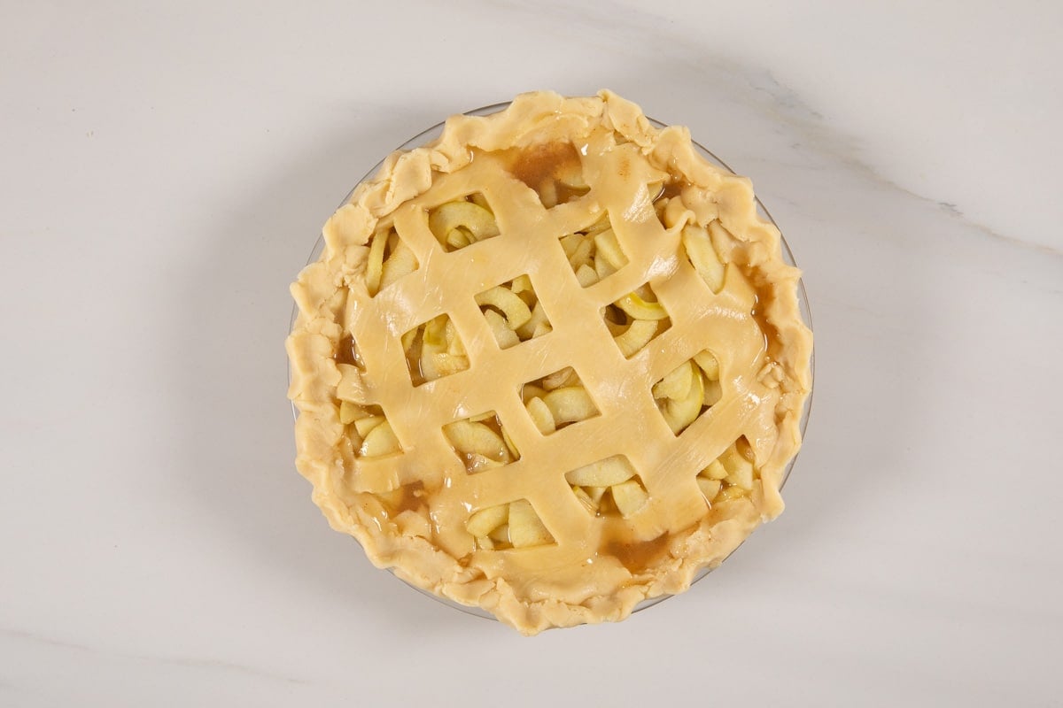 process shot of apple cider pie being made.