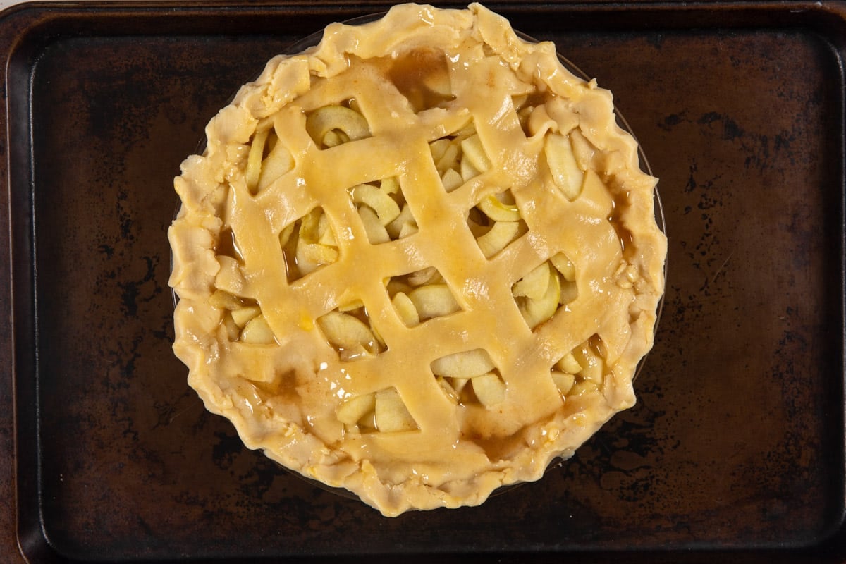 process shot of apple cider pie being made.