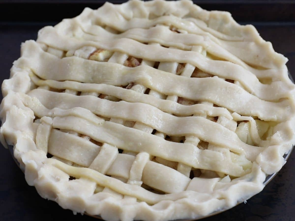 lattice pie unbaked on cookie sheet.