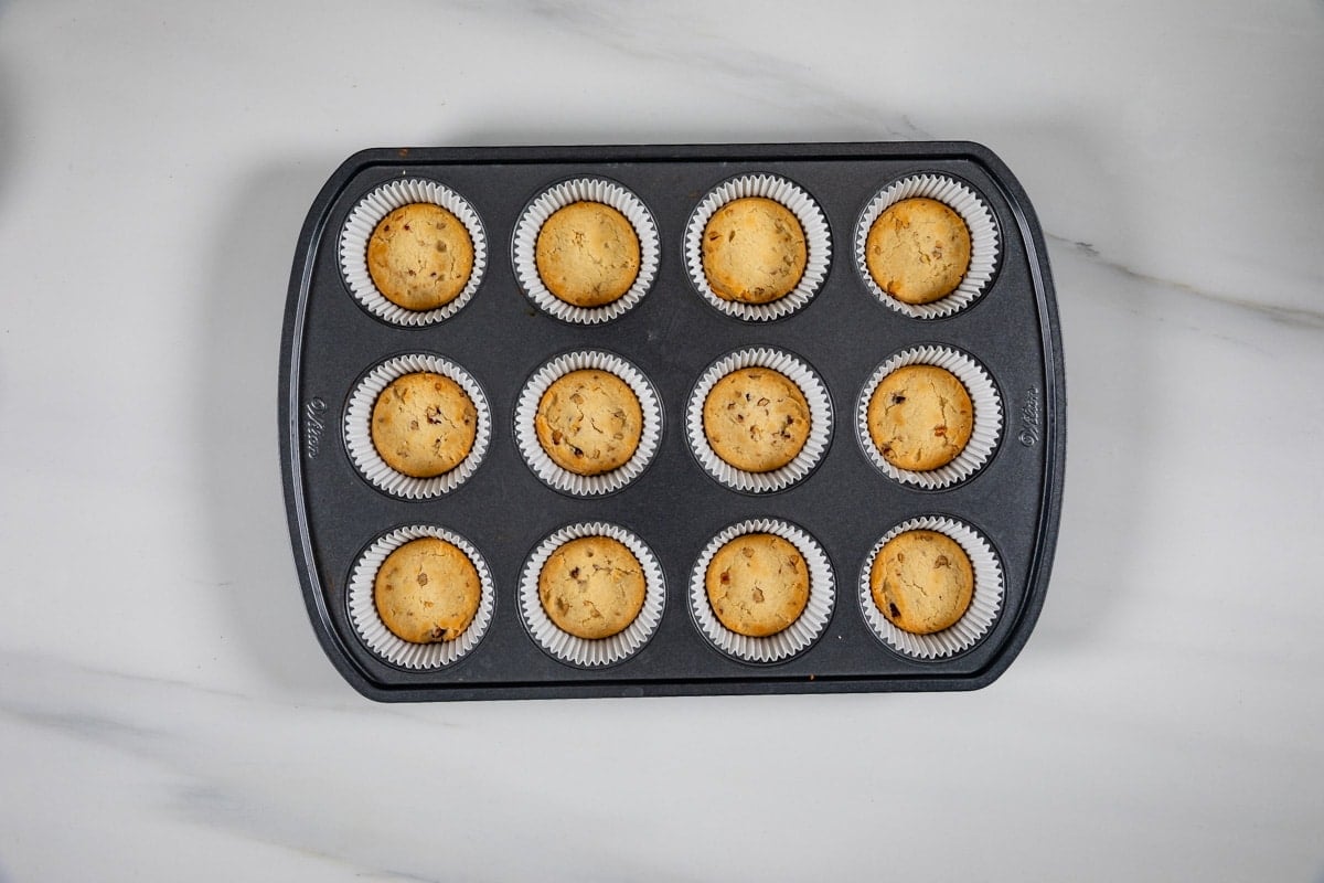 process shot of pecan pie cheesecakes being made.