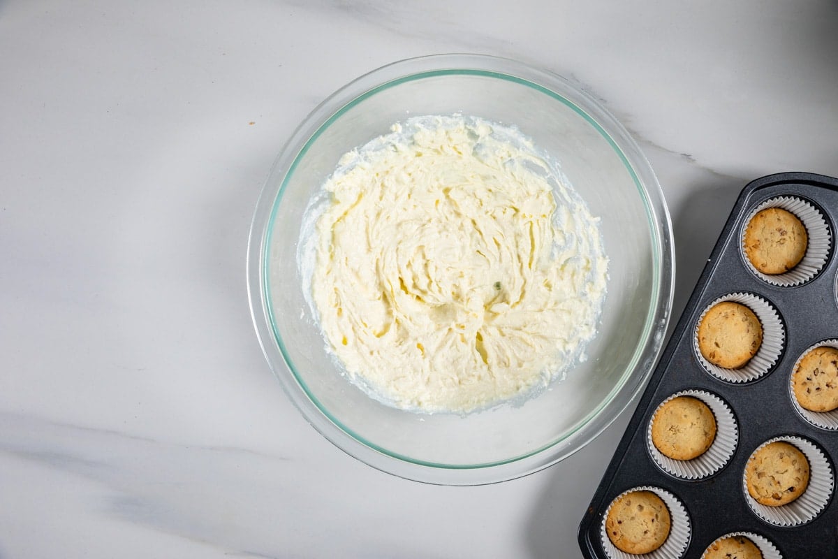 process shot of pecan pie cheesecakes being made.