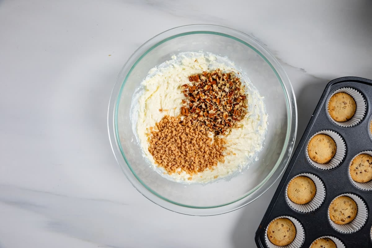 process shot of pecan pie cheesecakes being made.