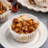 mini pecan pie cheesecake in a white cupcake wrapper.