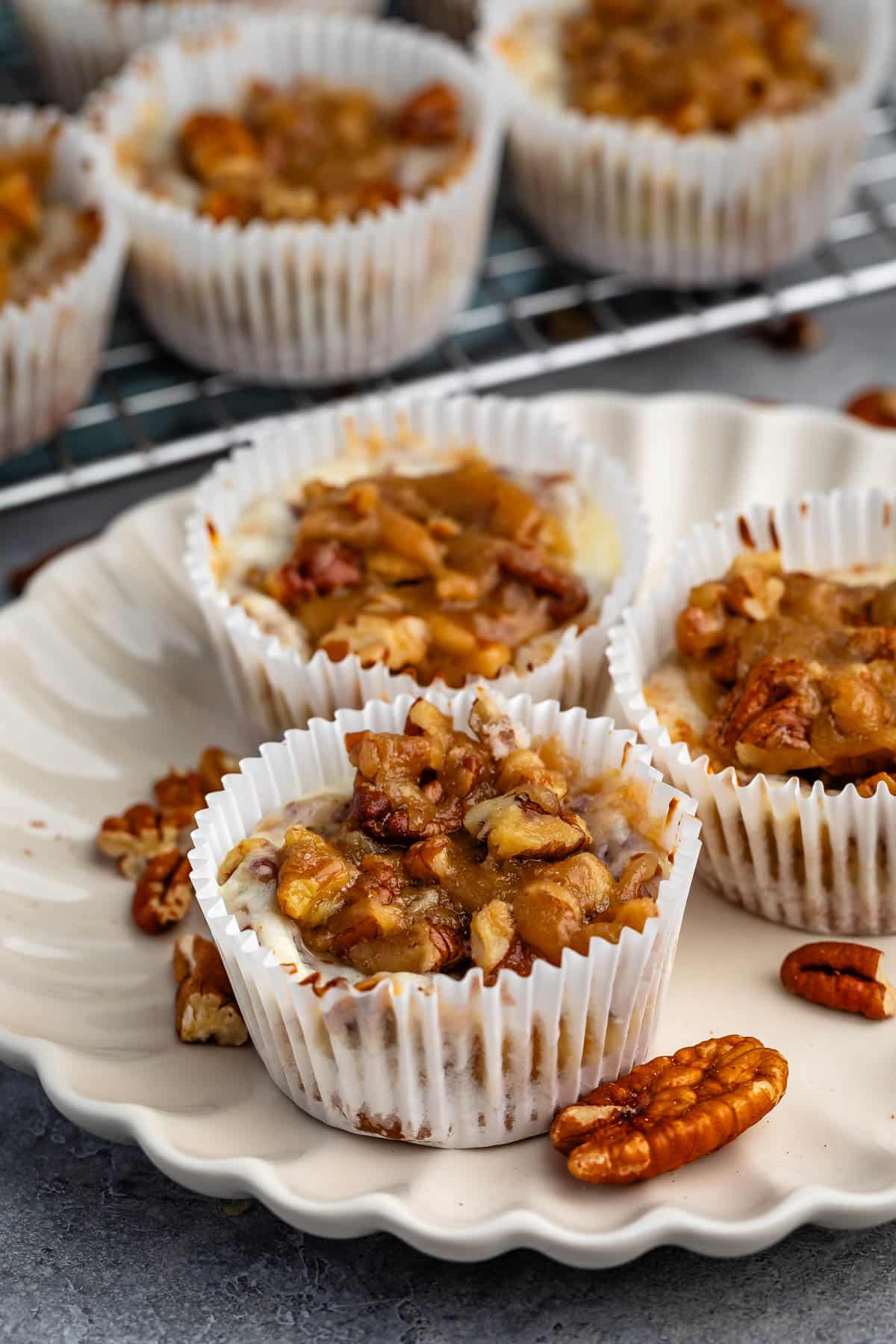 mini pecan pie cheesecake in a white cupcake wrapper.