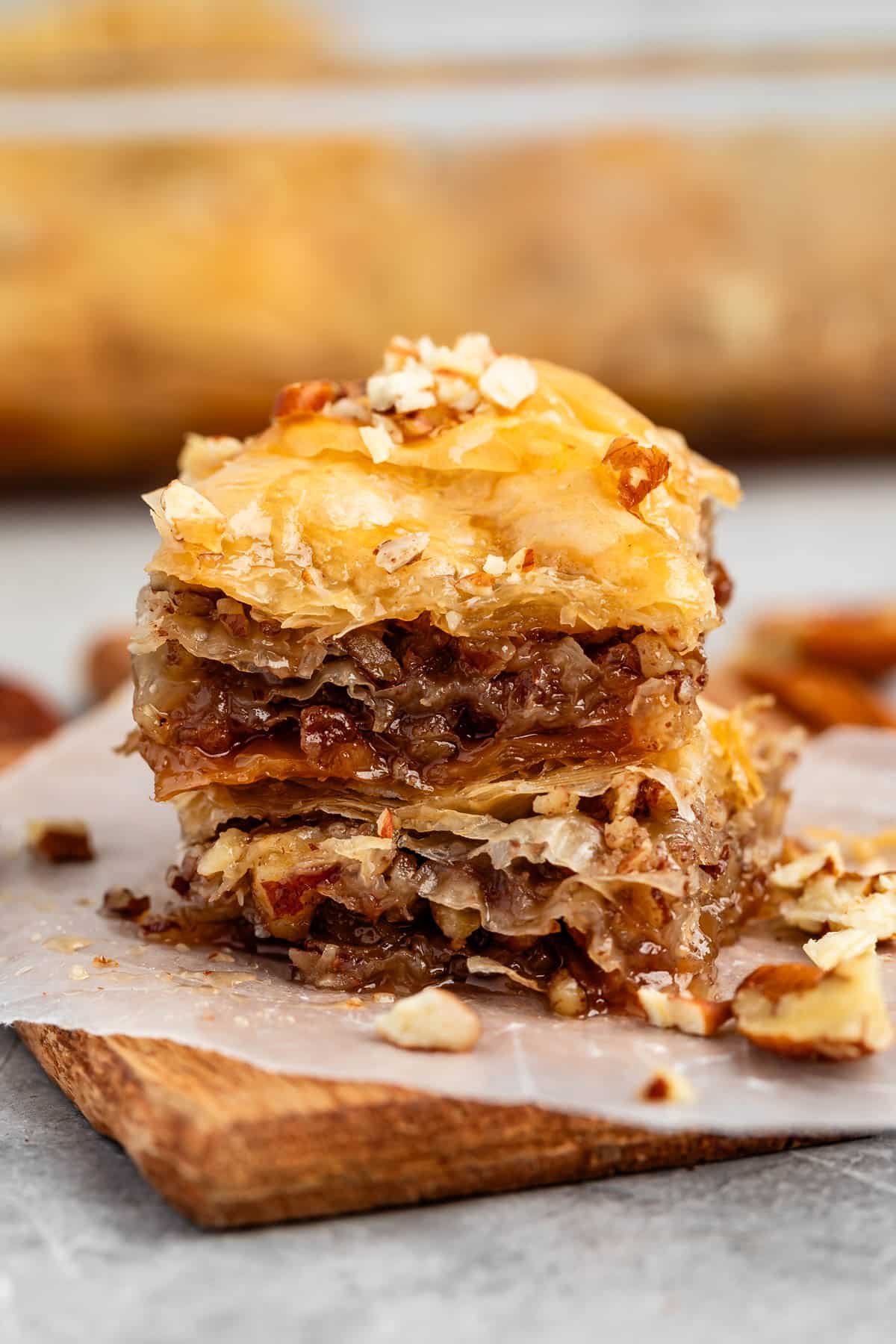 stacked baklava with pecans layered in it.