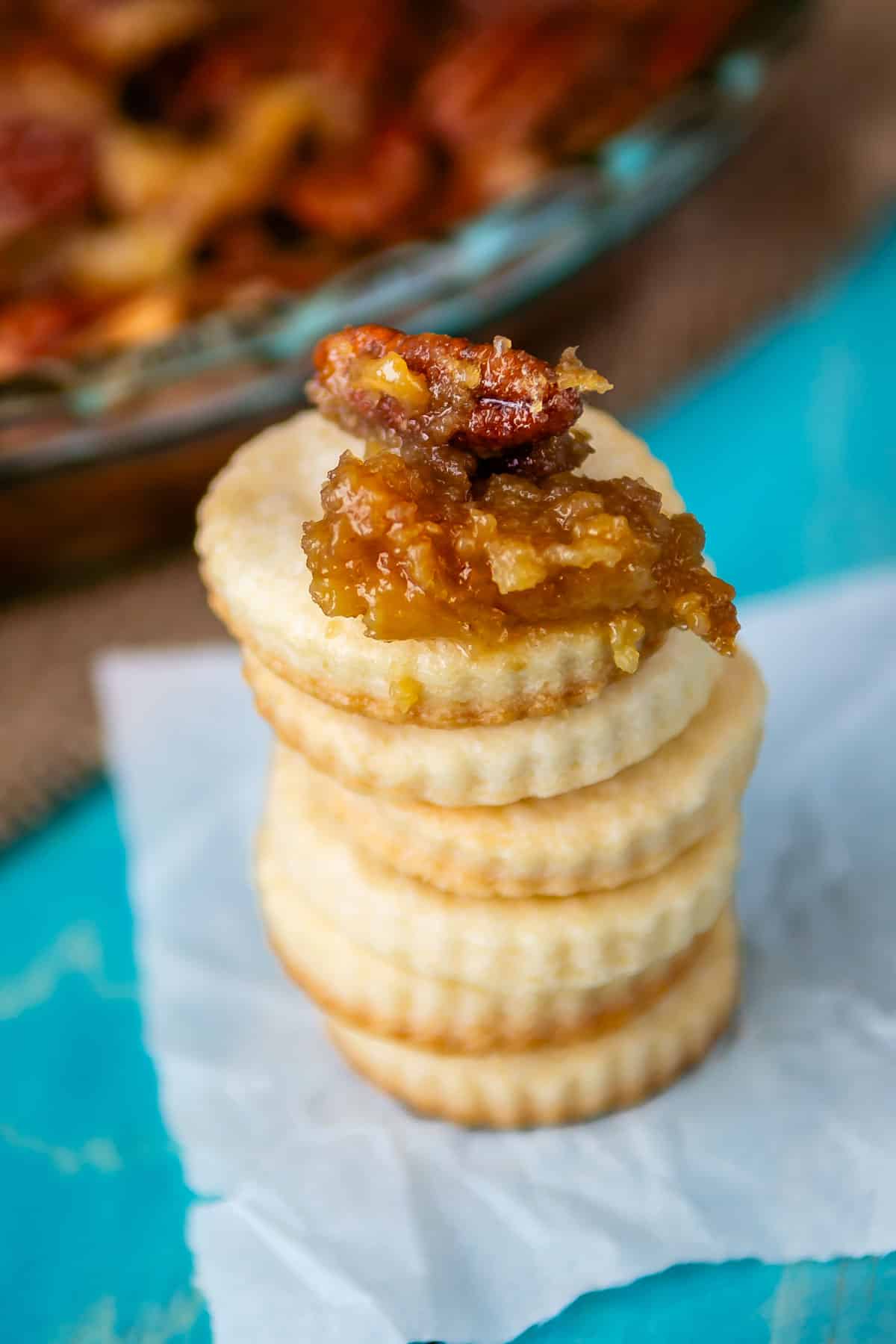 stacked crust cookies with pecan dip on top.