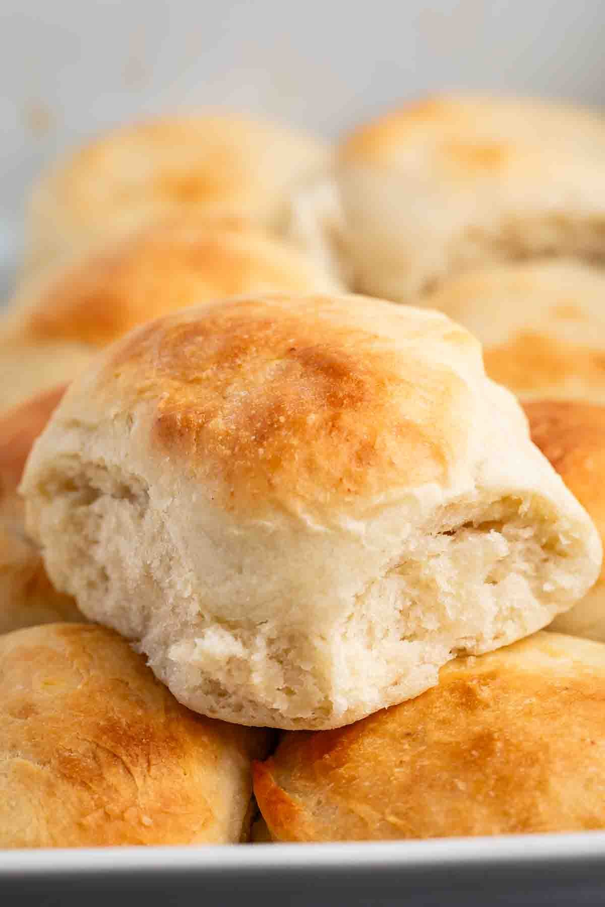 golden rolls in a white glass pan.