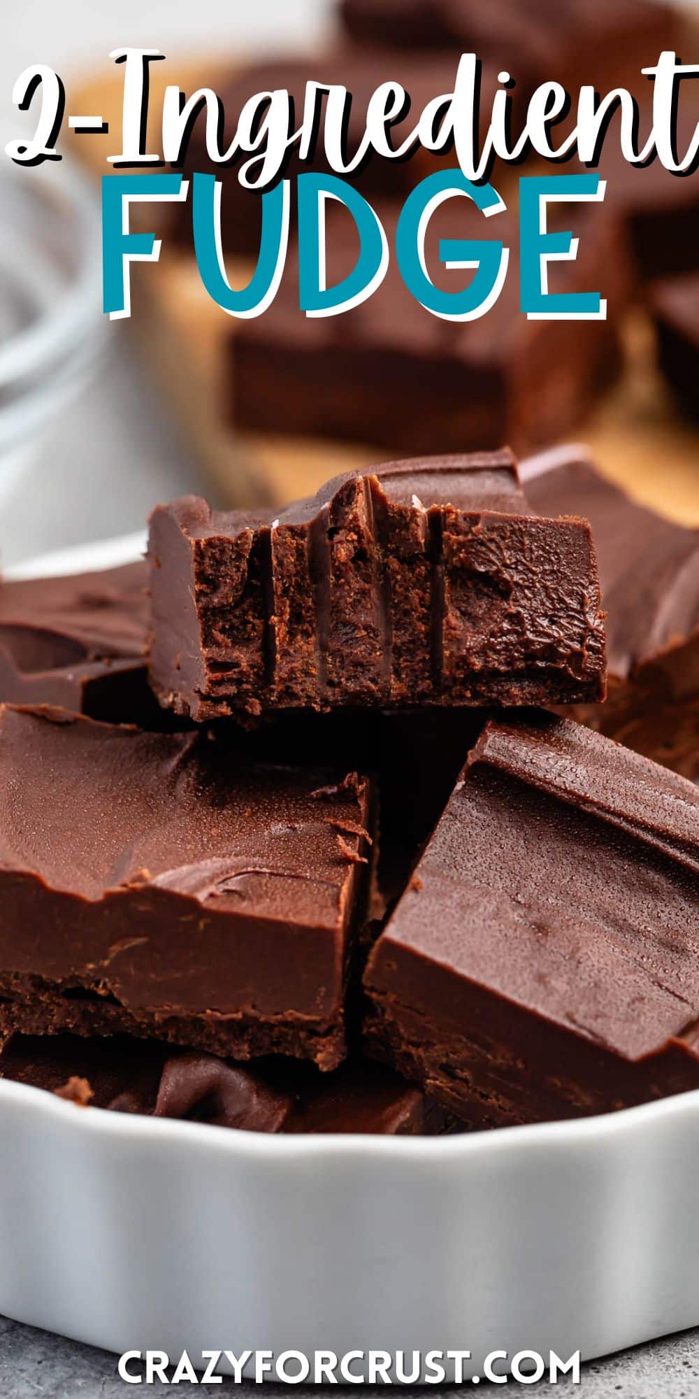 stacked brown fudge in a white dish with words on the image.