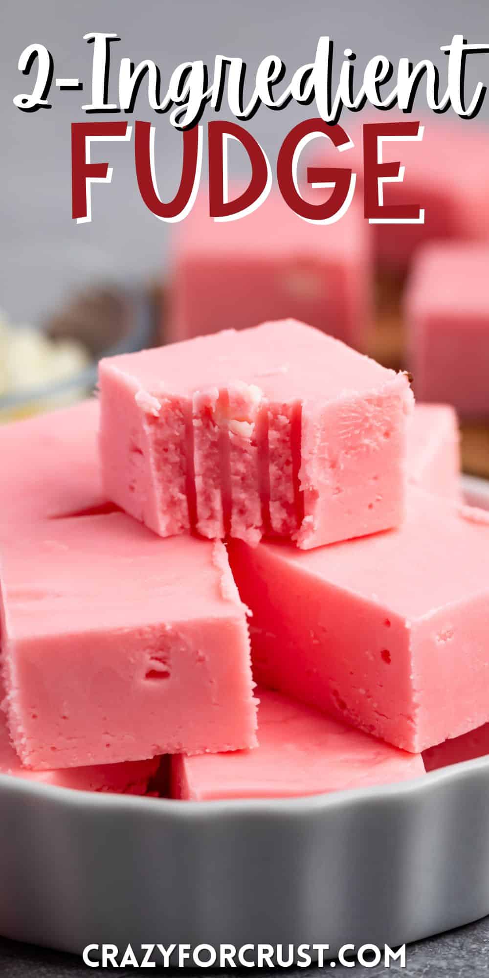 stacked pink fudge in a white dish with words on the image.