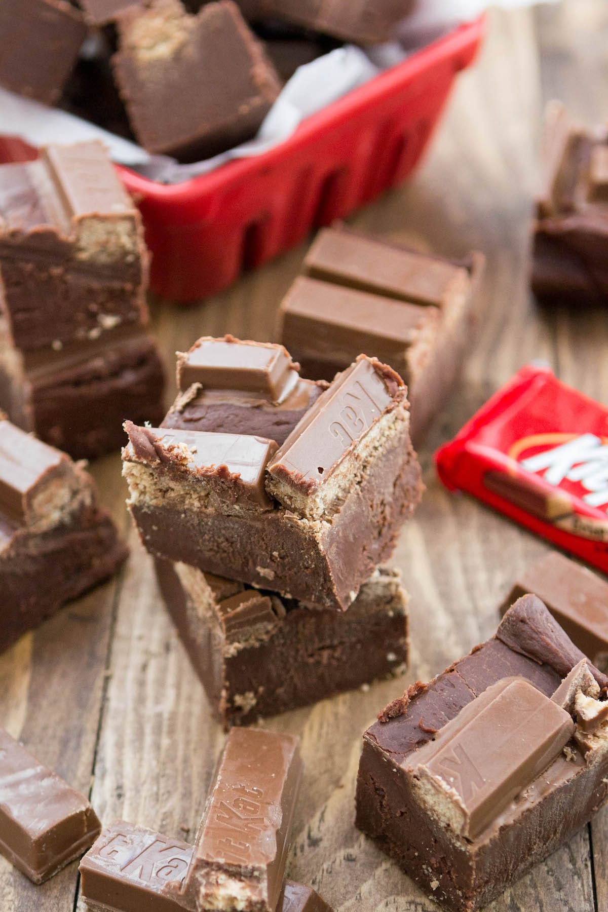 stacked fudge with KitKats on top near wrapped KitKats.