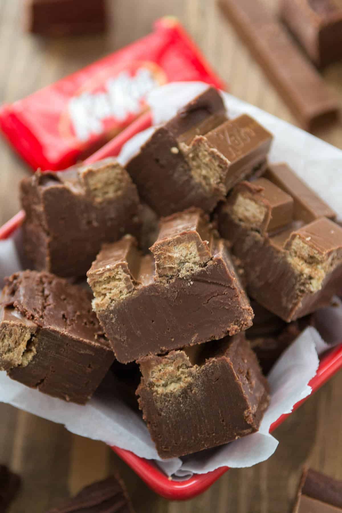 stacked fudge with KitKats on top near wrapped KitKats.