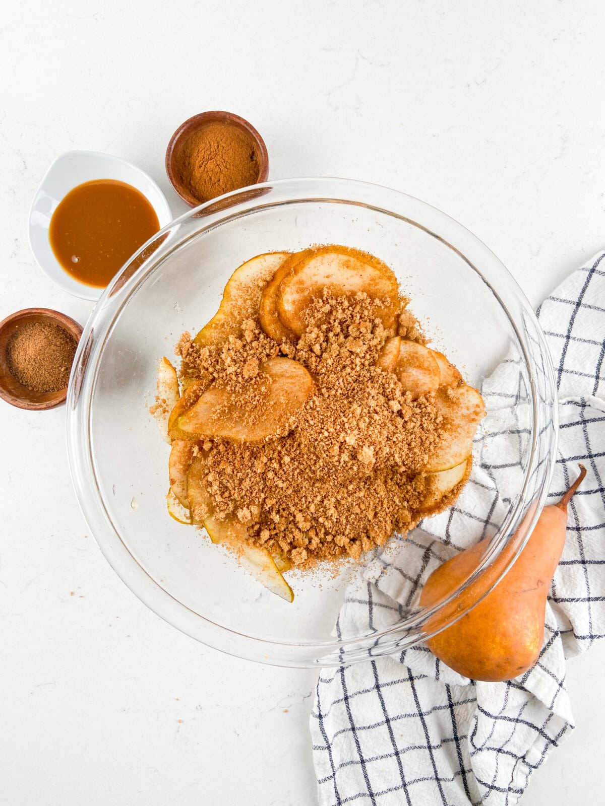 pears in bowl with brown sugar and spices.