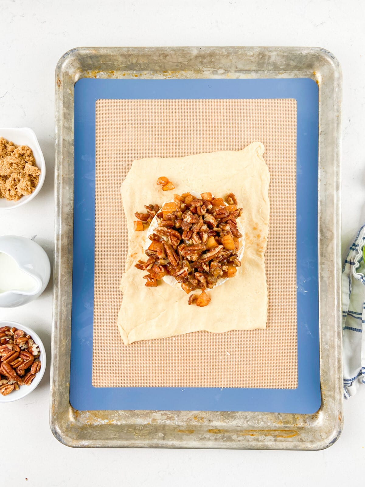 process shot of pecan apple baked brie.