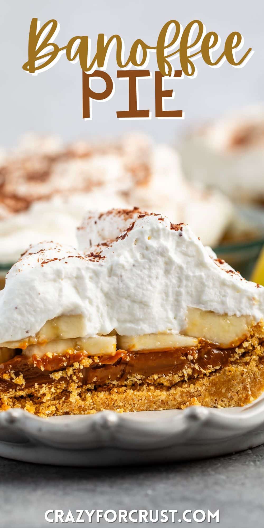 pie layered with graham cracker crust and chocolate and bananas and whipped cream on a white plate with words on the image.