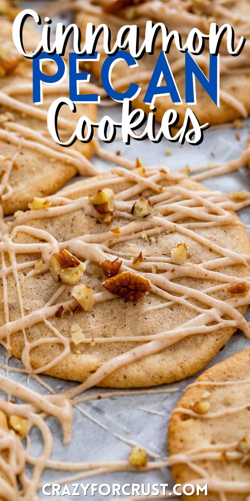 cookies laid out on parchment paper with icing and chopped pecans sprinkled over top with words on the image.