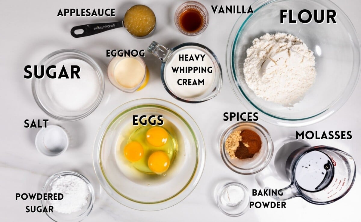 ingredients in gingerbread cake roll laid out on a marble countertop.