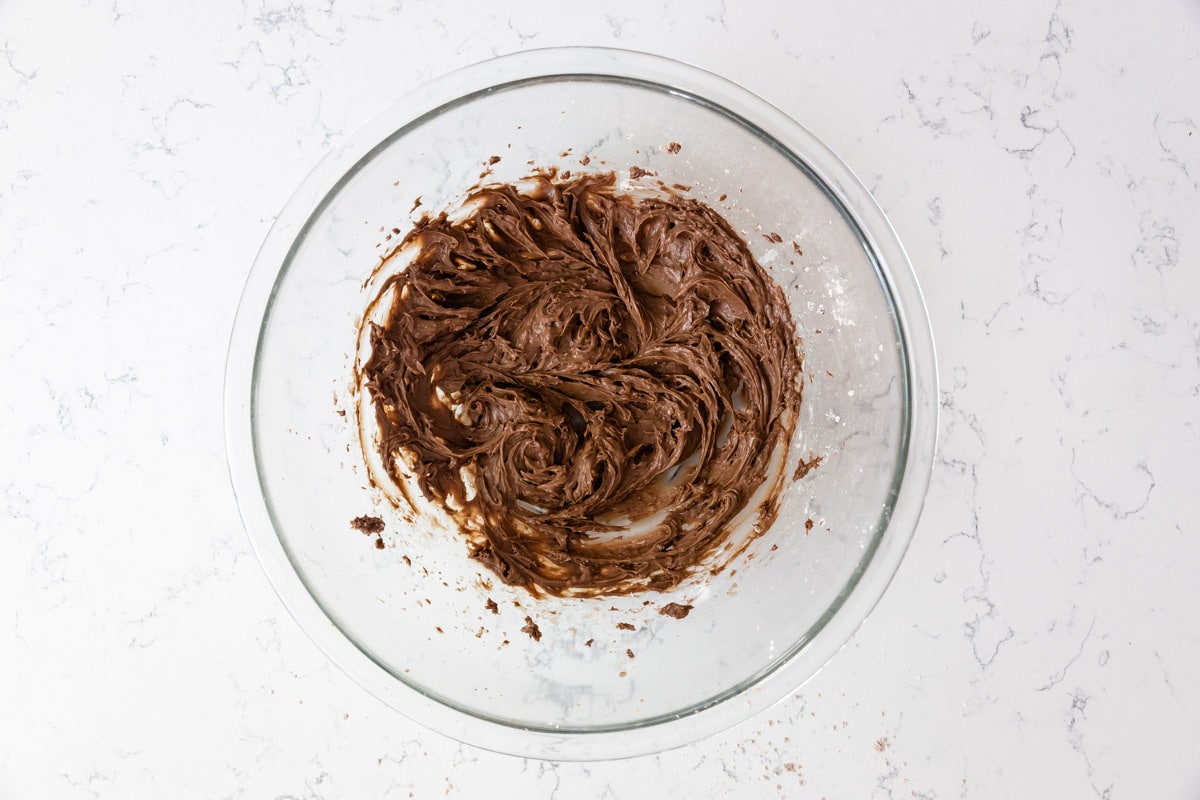 chocolate frosting in bowl.