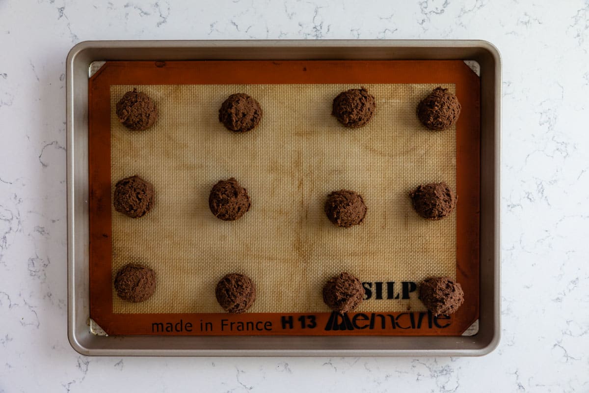 chocolate cookie dough on cookie sheet.