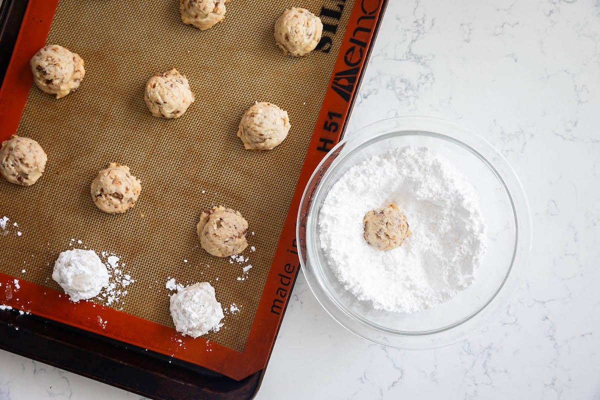 process shot of toffee snowballs being made.