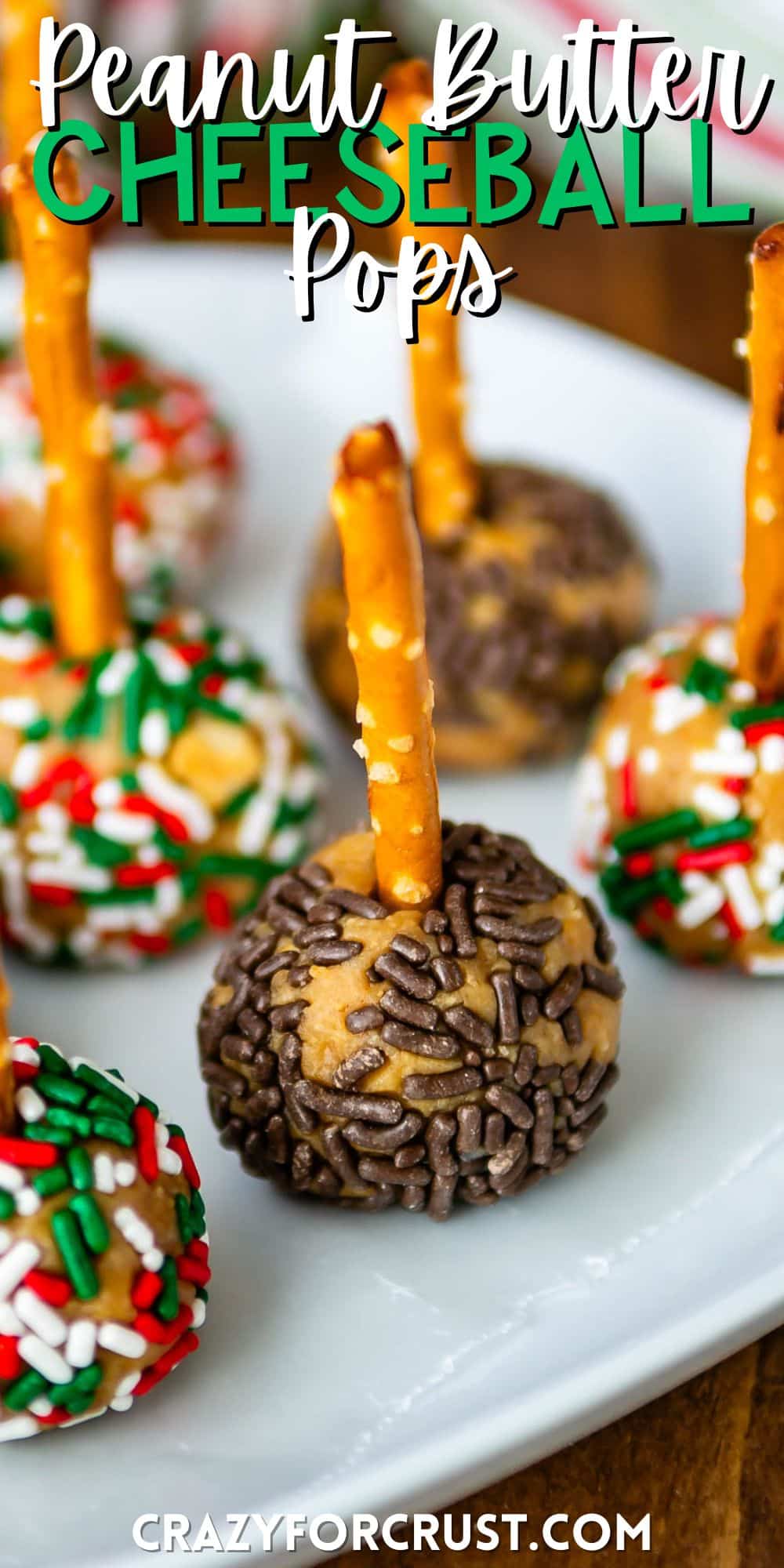 peanut butter balls with sprinkles pressed in the side on a pretzel stick with words on the image.