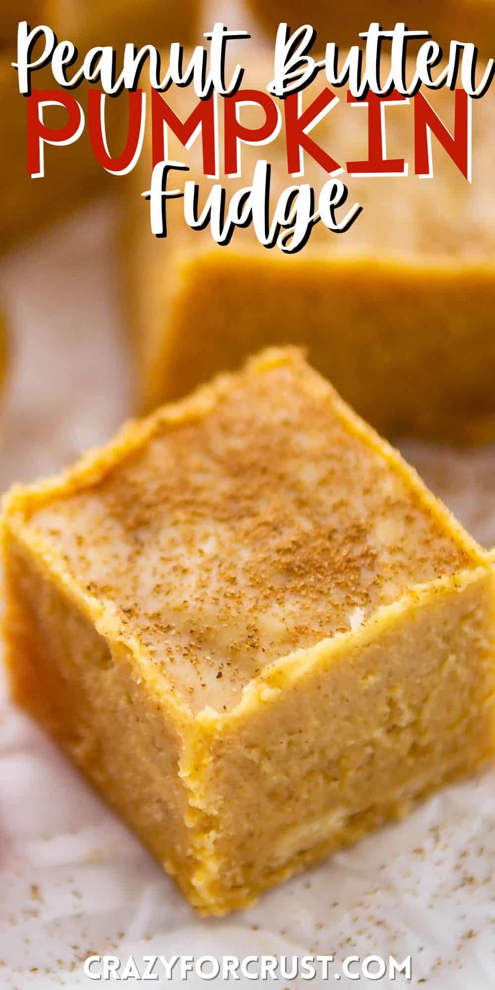 orange fudge with spices sprinkled on top with words on the image.
