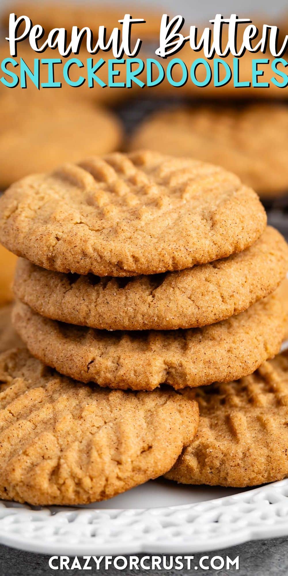 stacked peanut butter snickerdoodles on a white plate next to a spoonful of peanut butter with words on the image.