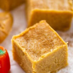 orange fudge with spices sprinkled on top.