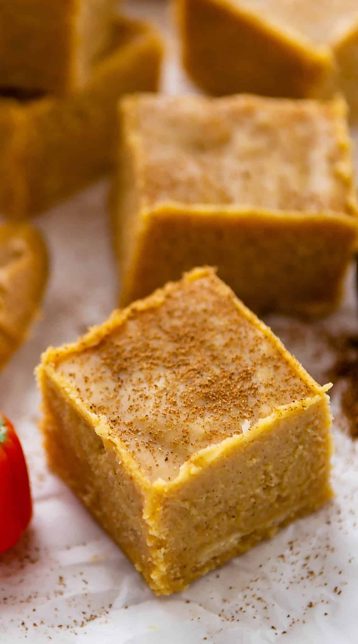 orange fudge with spices sprinkled on top.
