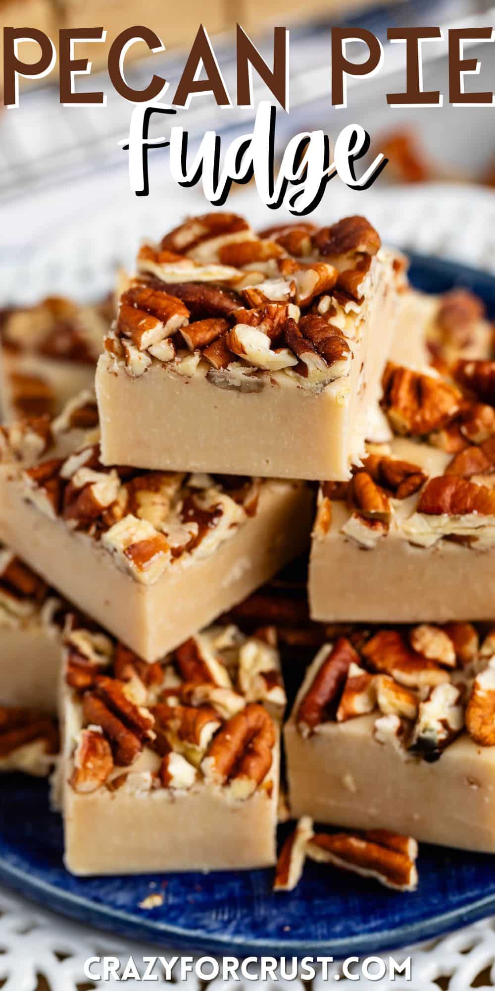 stacked pecan fudge with chopped pecan pressed on top on a blue plate with words on the image.