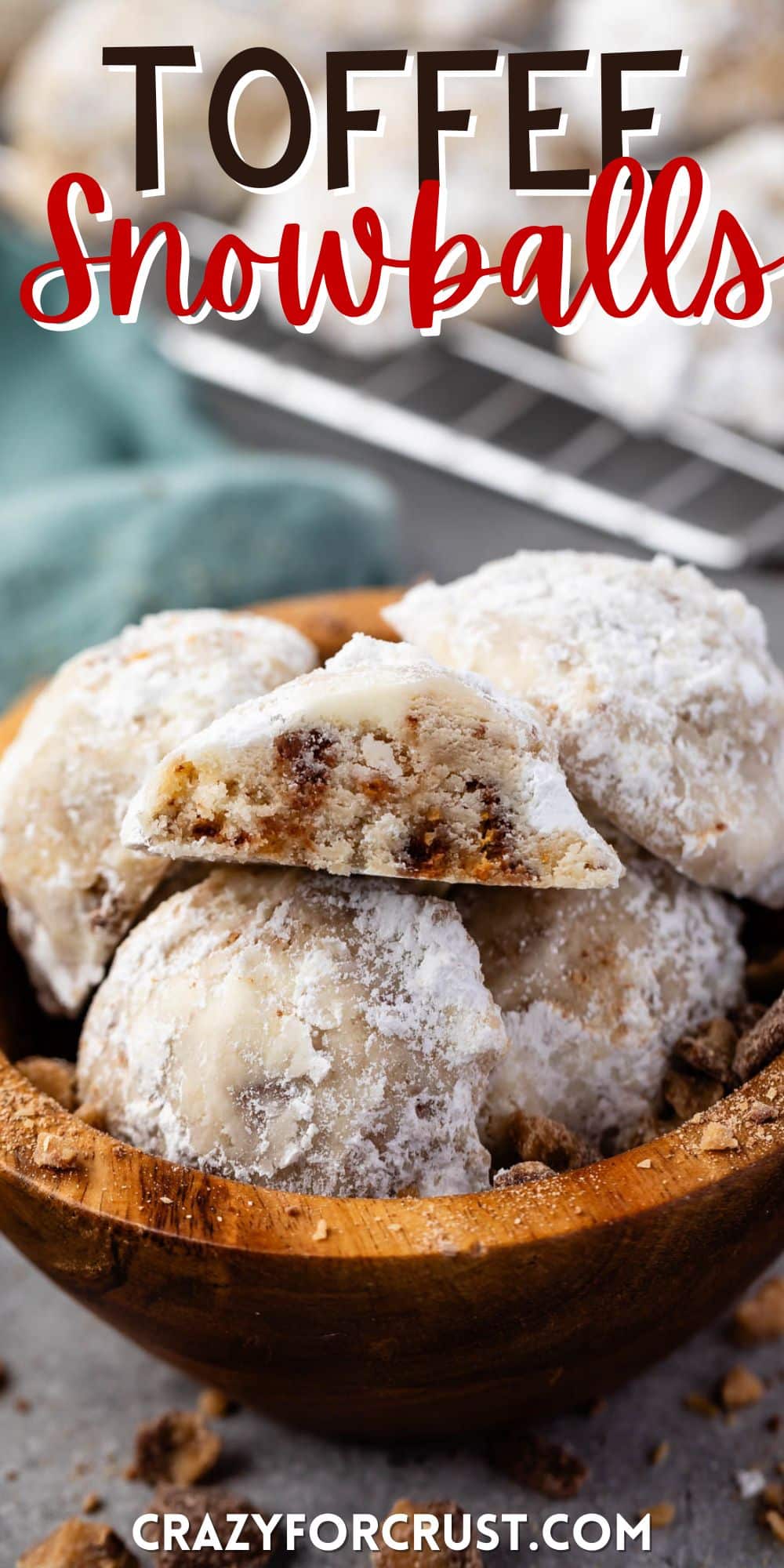 stacked snowballs covered in powdered sugar in a wood bowl with words on the image.