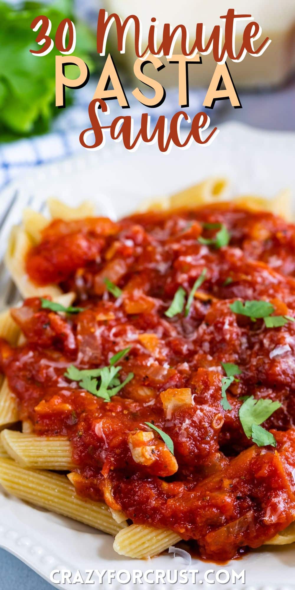 red pasta sauce on top of pasta on a white plate with words on the image.