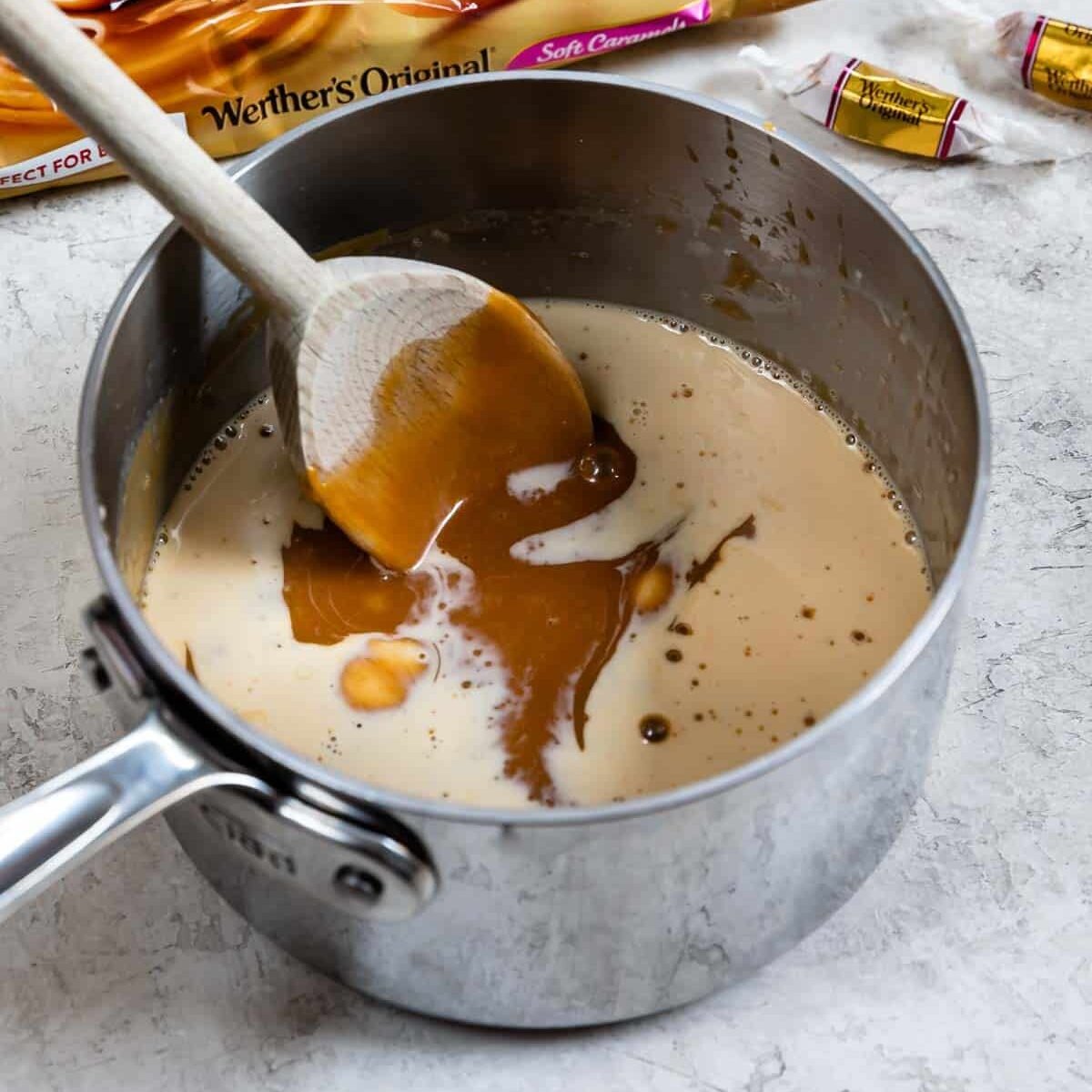 spoon stirring caramel sauce.