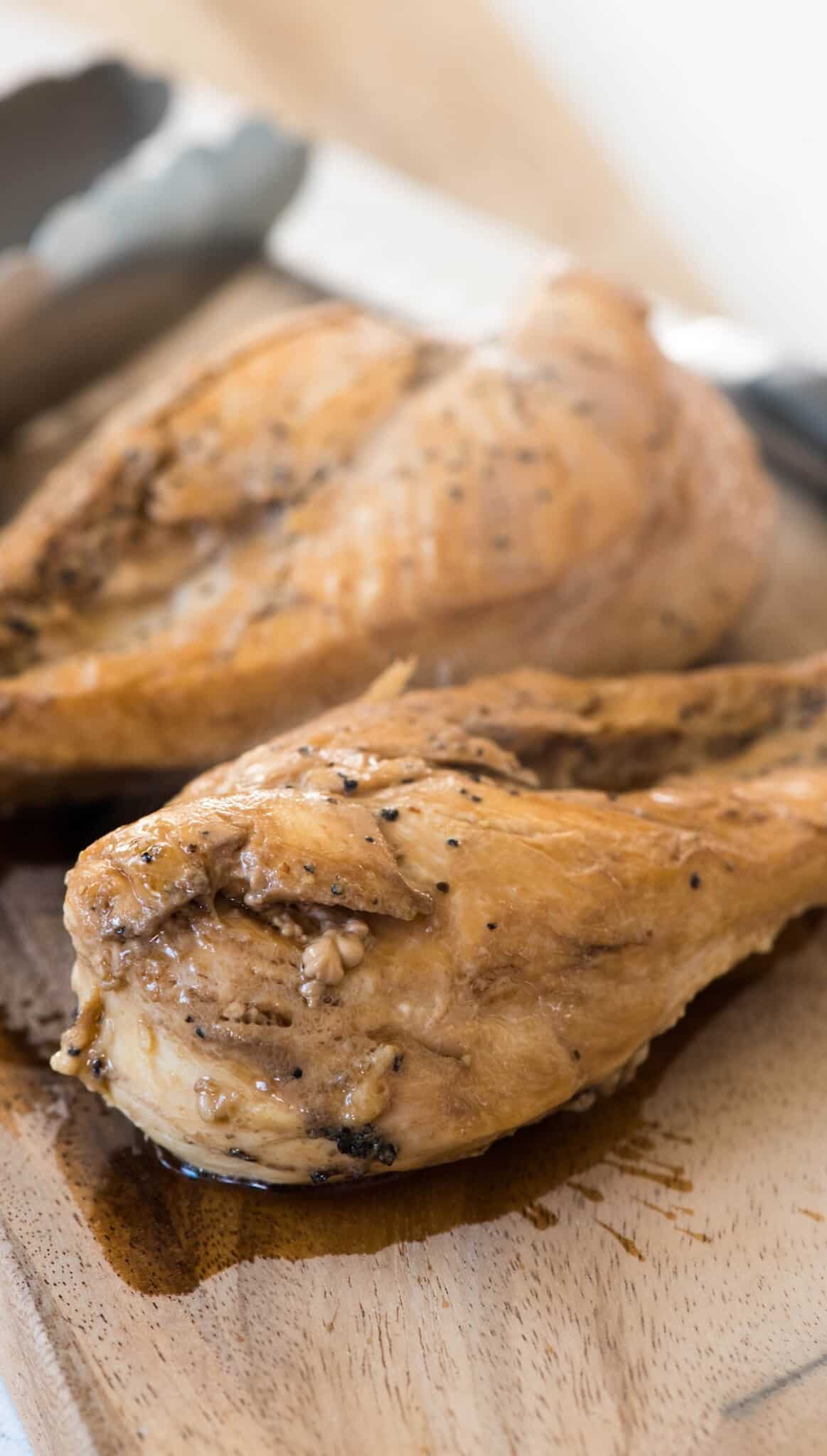 full chicken on a cutting board.