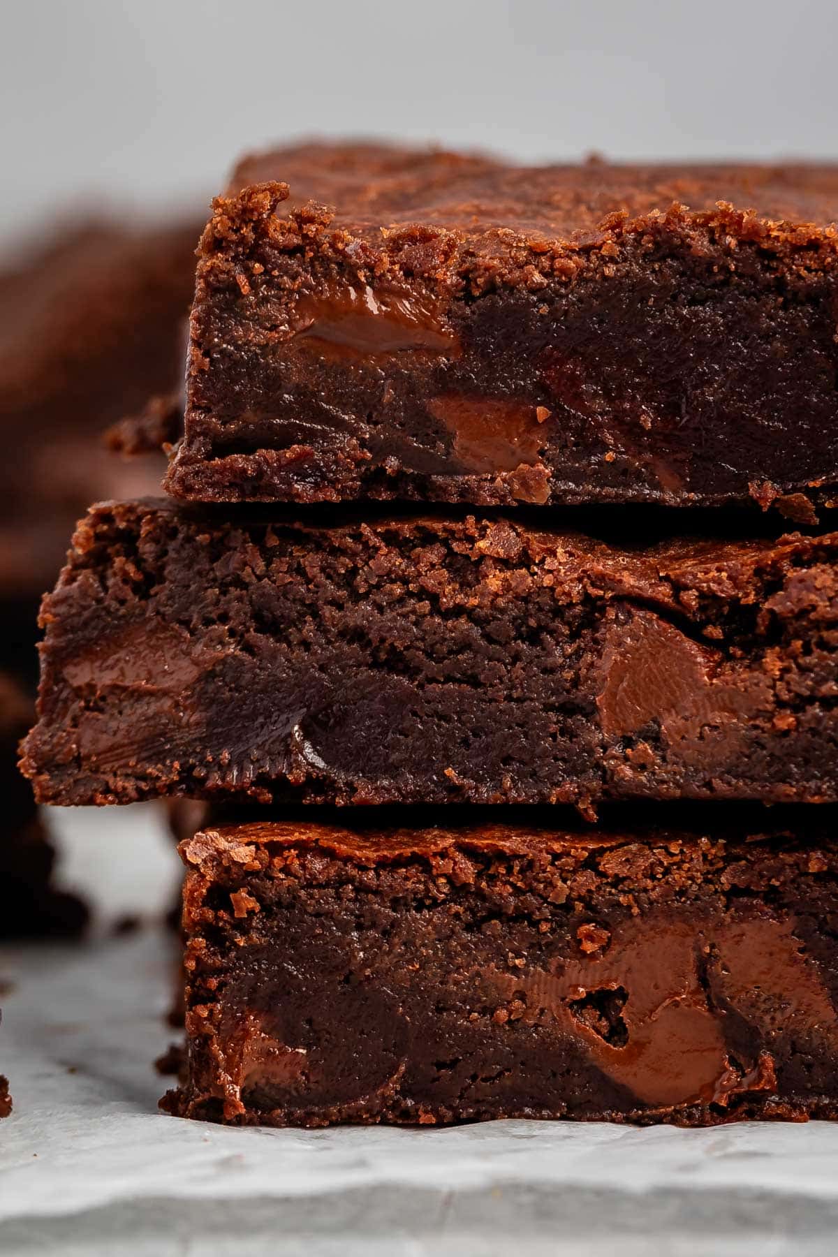 stacked brownies with chocolate chips baked in on the inside.