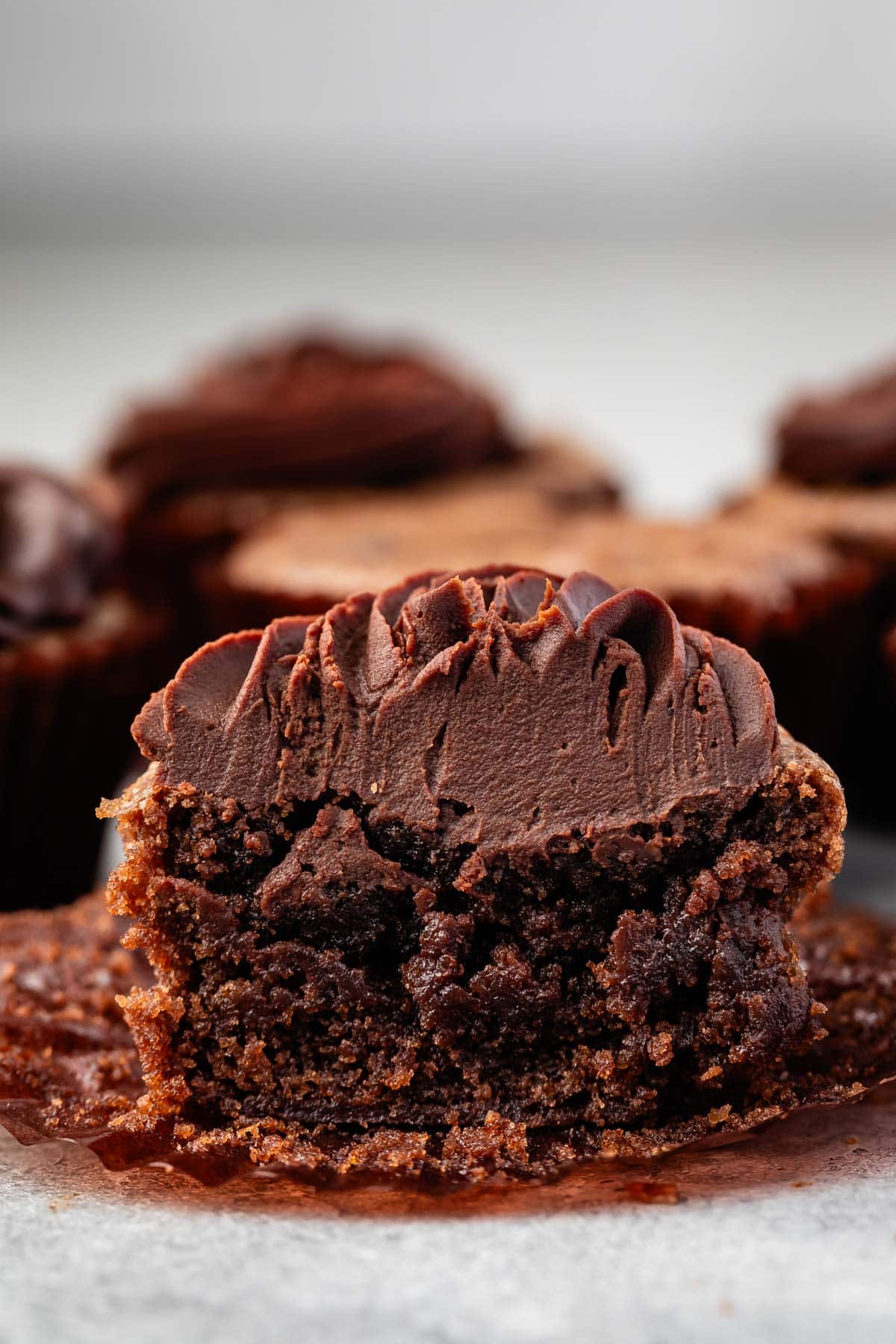 cupcake made of brownies with chocolate frosting on top.