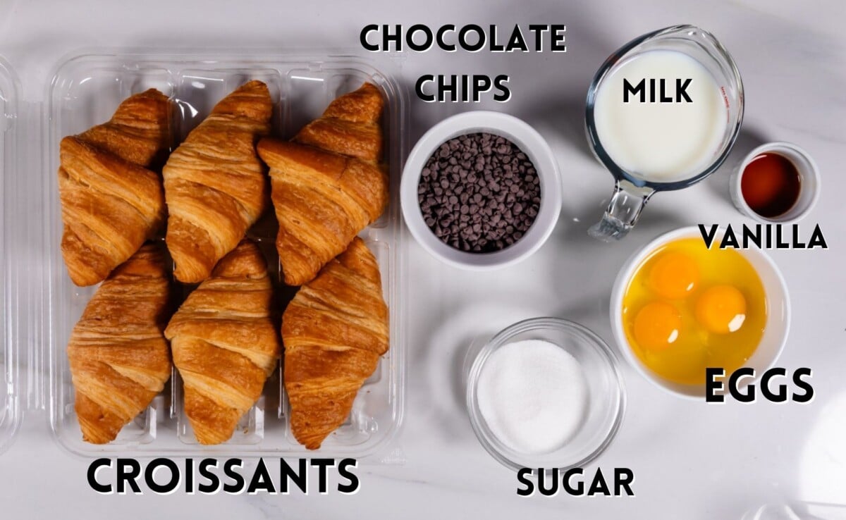 ingredients in croissant French toast laid out on a white marble counter.