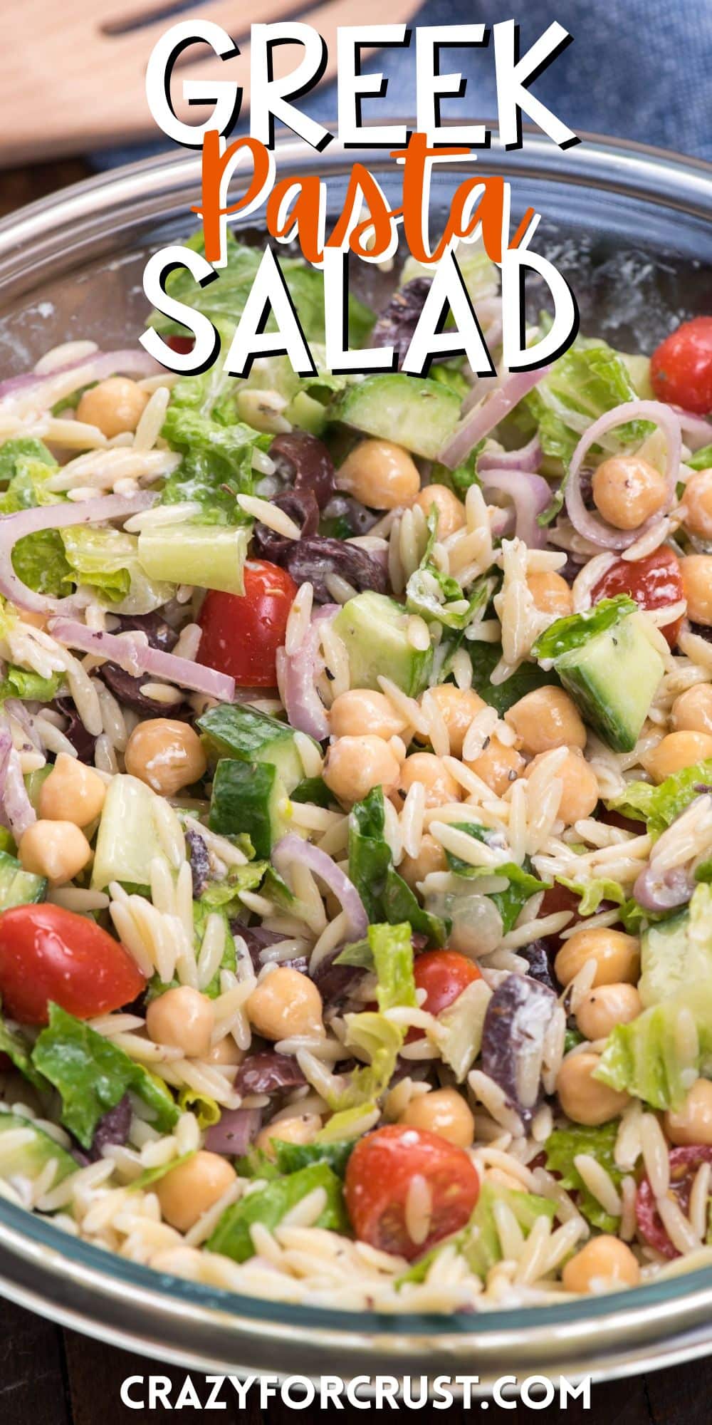 salad mixed together with dressing in a clear bowl with words on the image.