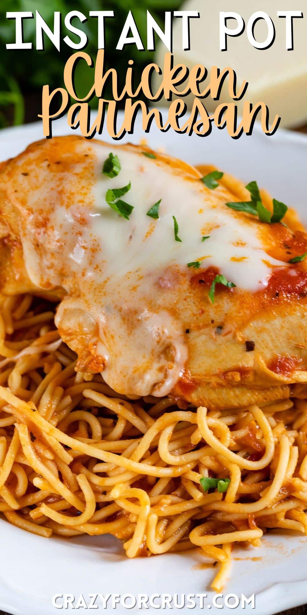 chicken breast on top of spaghetti on a white plate with words on the image.