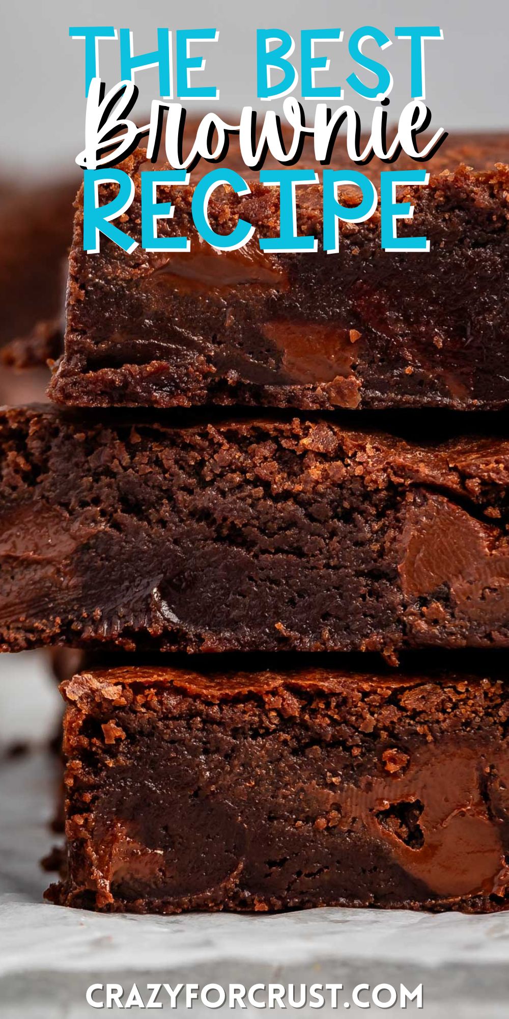 stacked brownies with chocolate chips baked in on the inside with words on the image.