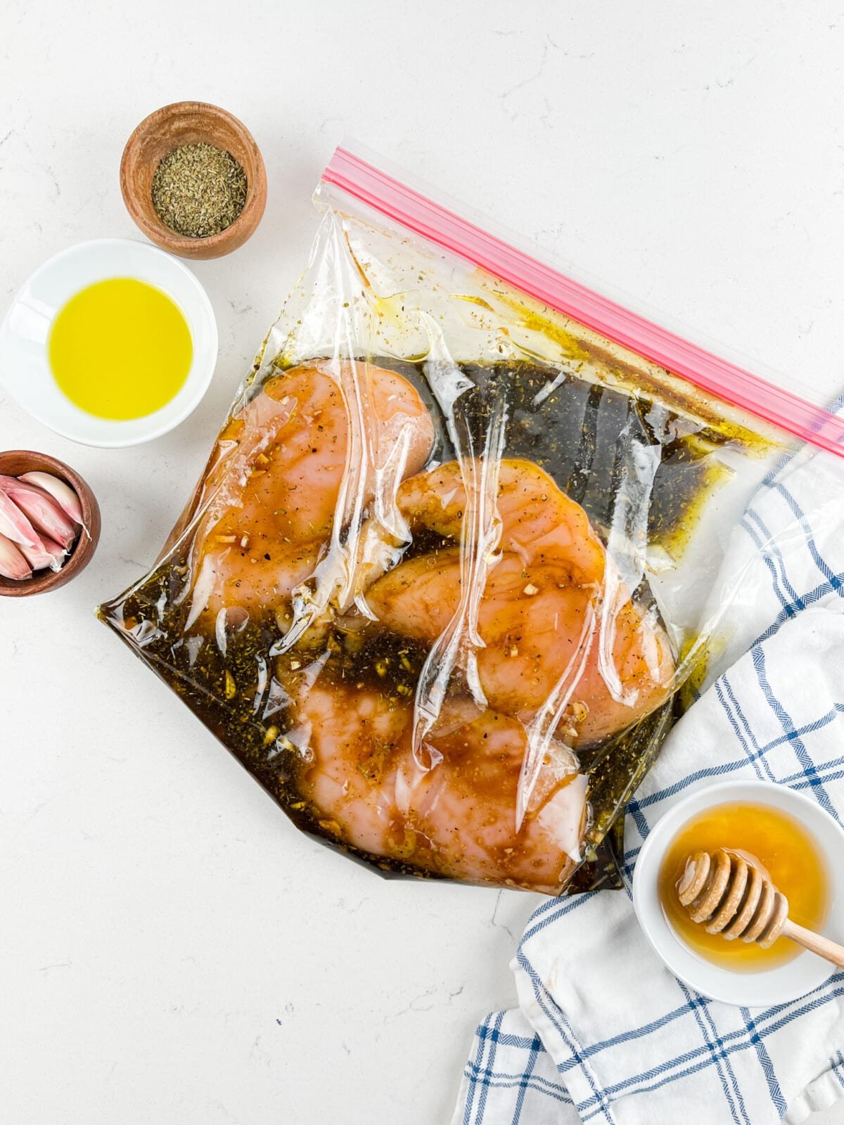 chicken marinating in plastic bag.