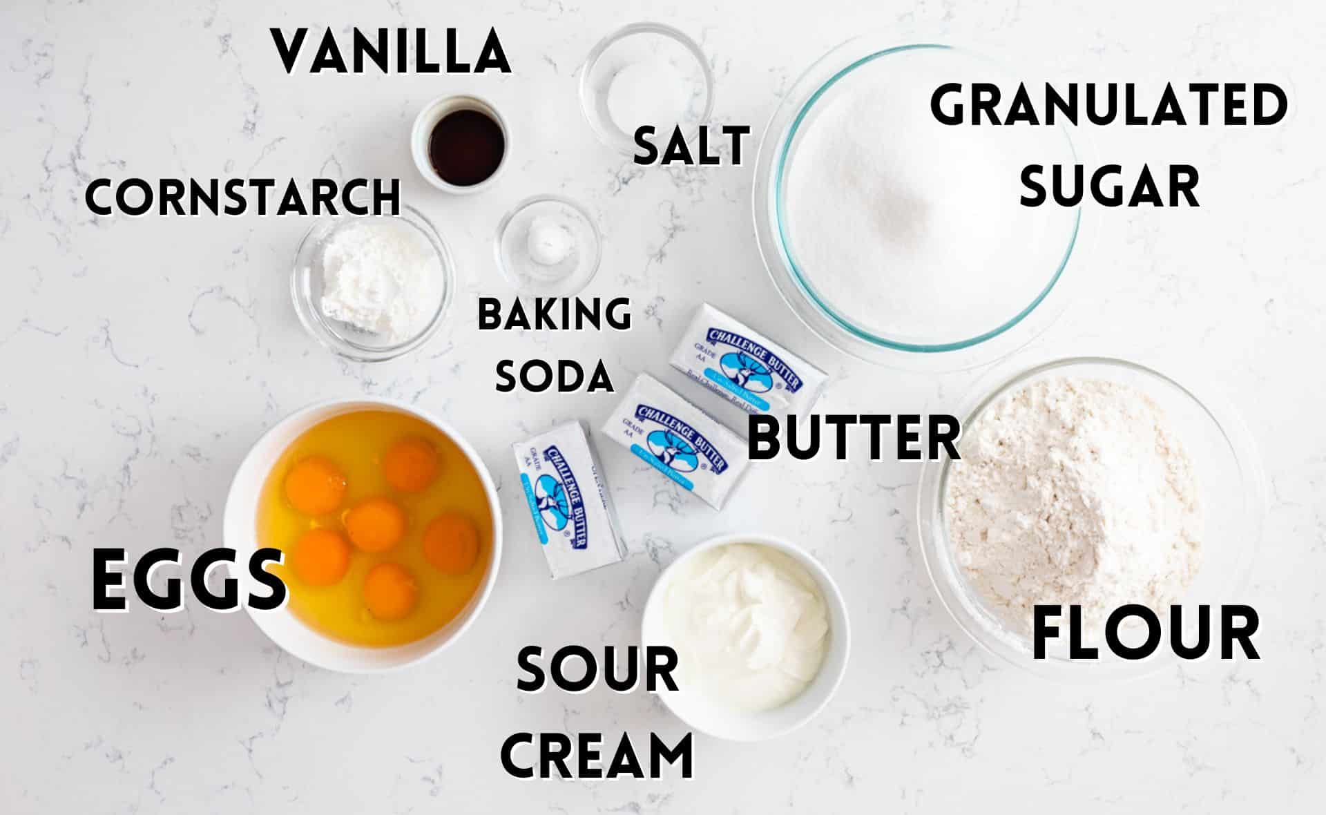ingredients in classic pound cake laid out on a marble counter.