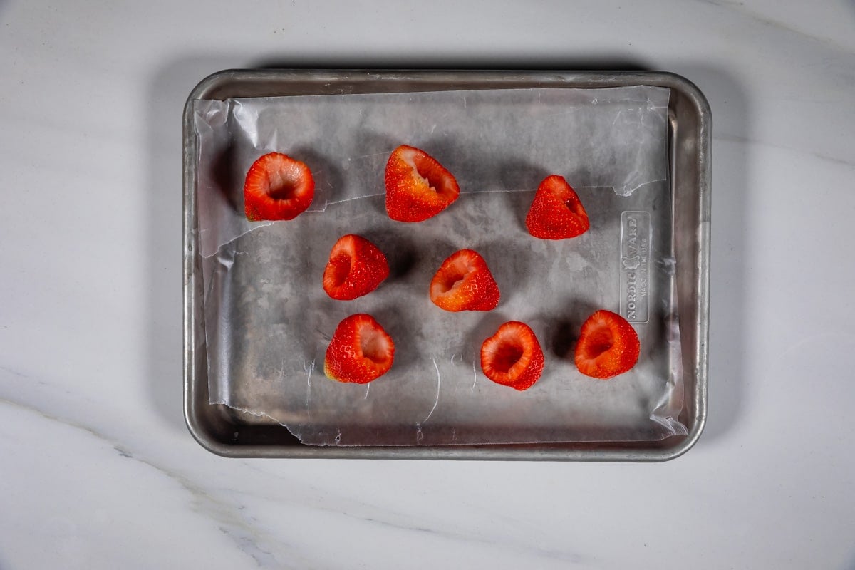 process shot of oreo truffle strawberries being made.