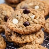 stacked oatmeal cookies with white and regular chocolate chips baked in.