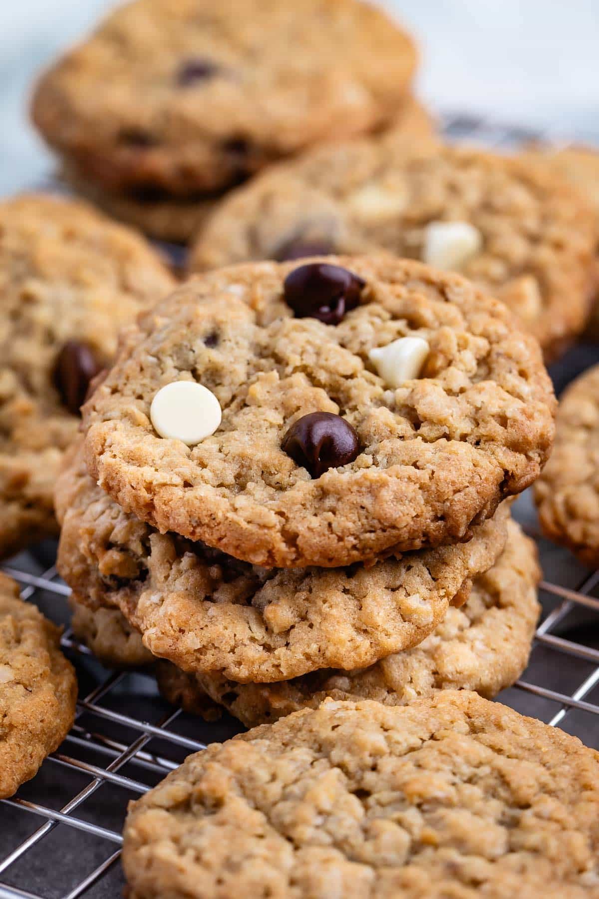 stacked oatmeal cookies with white and regular chocolate chips baked in.