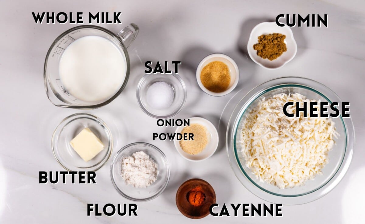 ingredients in totchos queso laid out on a white marble counter.