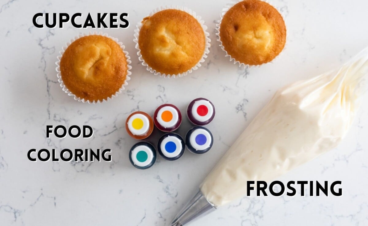 ingredients in rainbow frosting laid out on a marble counter.