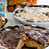 ice cream pie with chocolate on top in a metal pan.