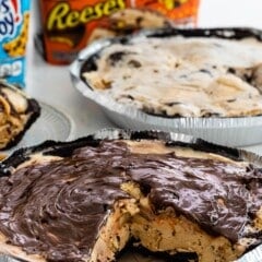 ice cream pie with chocolate on top in a metal pan.