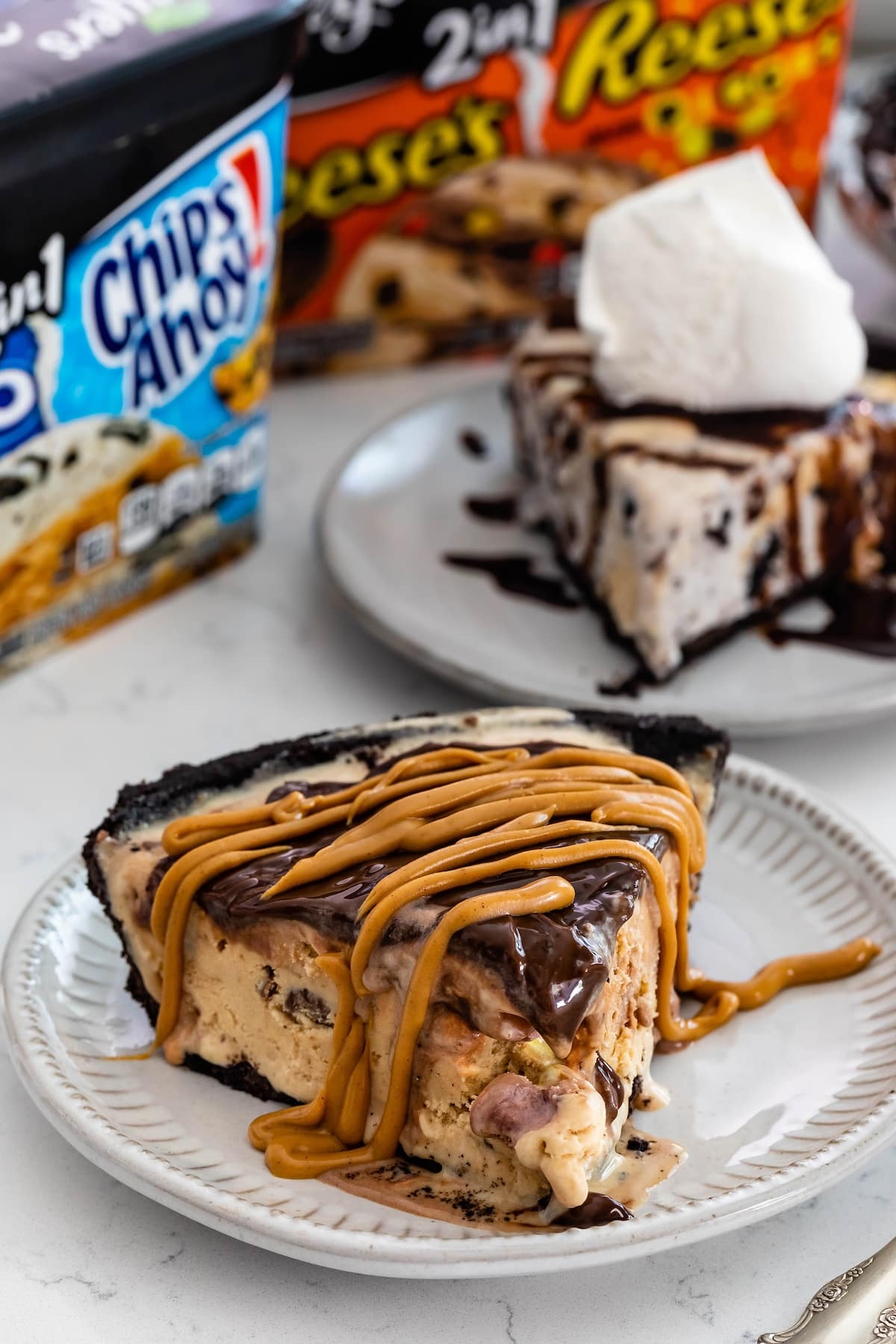 ice cream pie with chocolate on top on a grey plate.